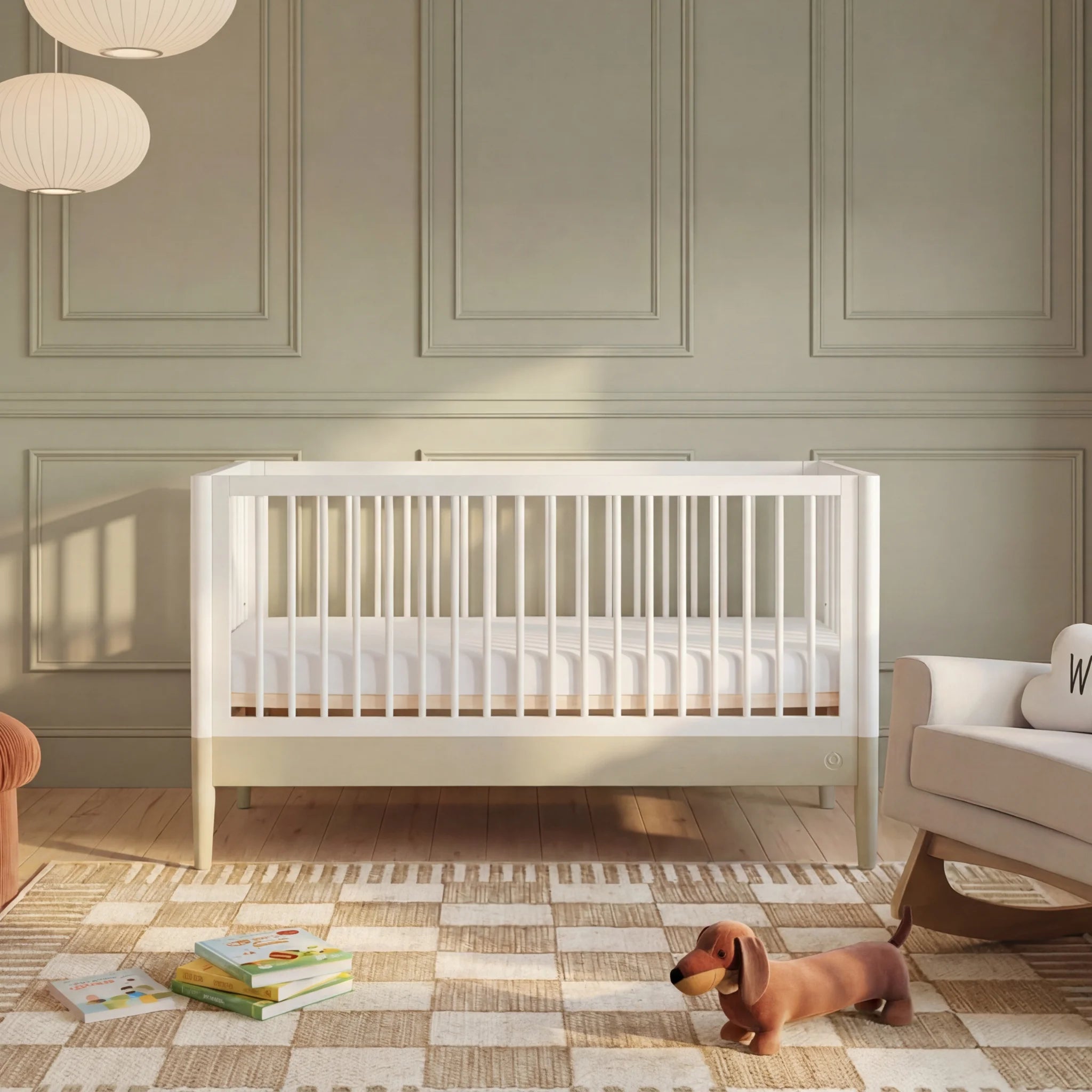 Gaia Baby EOS convertible cot in white styled in a sage green nursery.