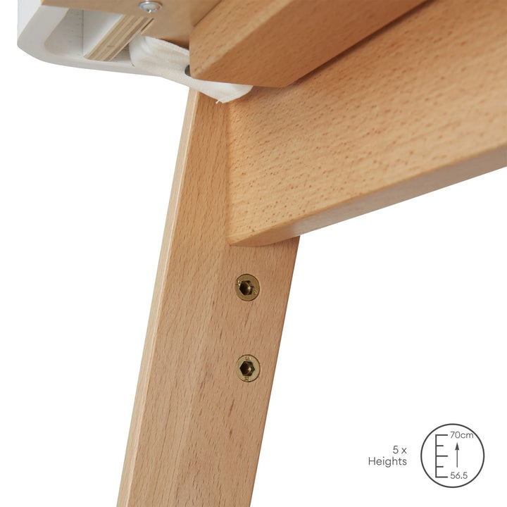 Hera bedside crib adjustable mattress heights close up.