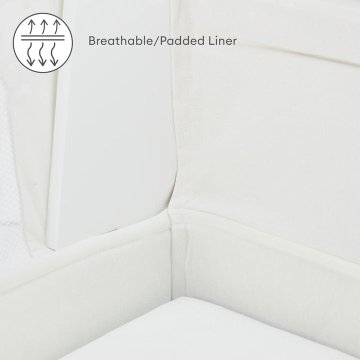 Hera bedisde crib close up of breathable and padded liner.