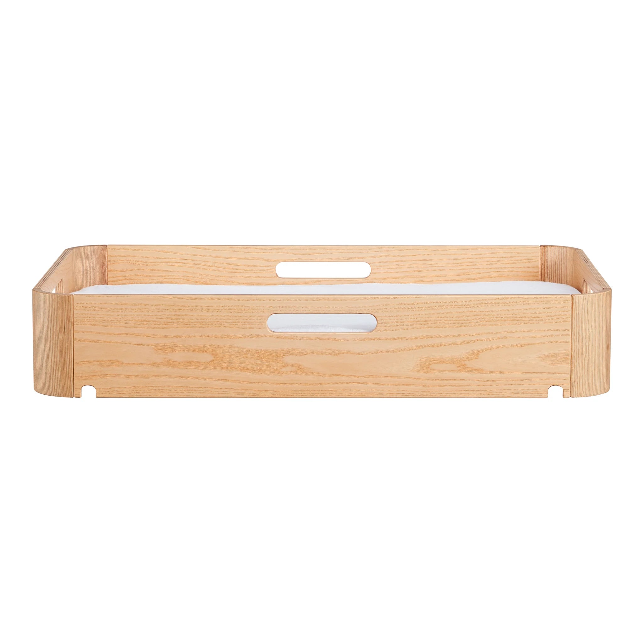 Side view of Gaia Baby portable Hera baby changing station in natural ash wood showing carrying handles and removable waterproof changing pad insert.