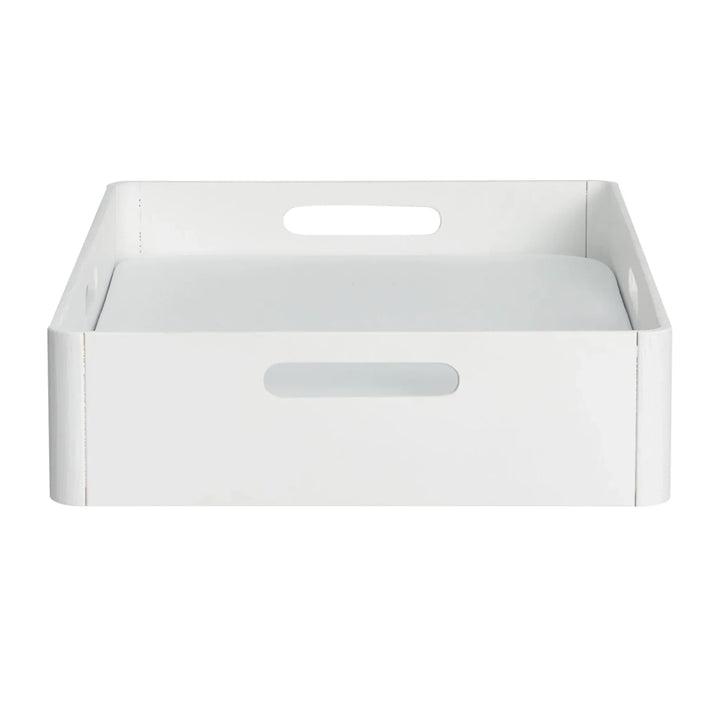 Front view of Gaia Baby portable Hera baby changing station in white wood with removable waterproof changing pad insert.