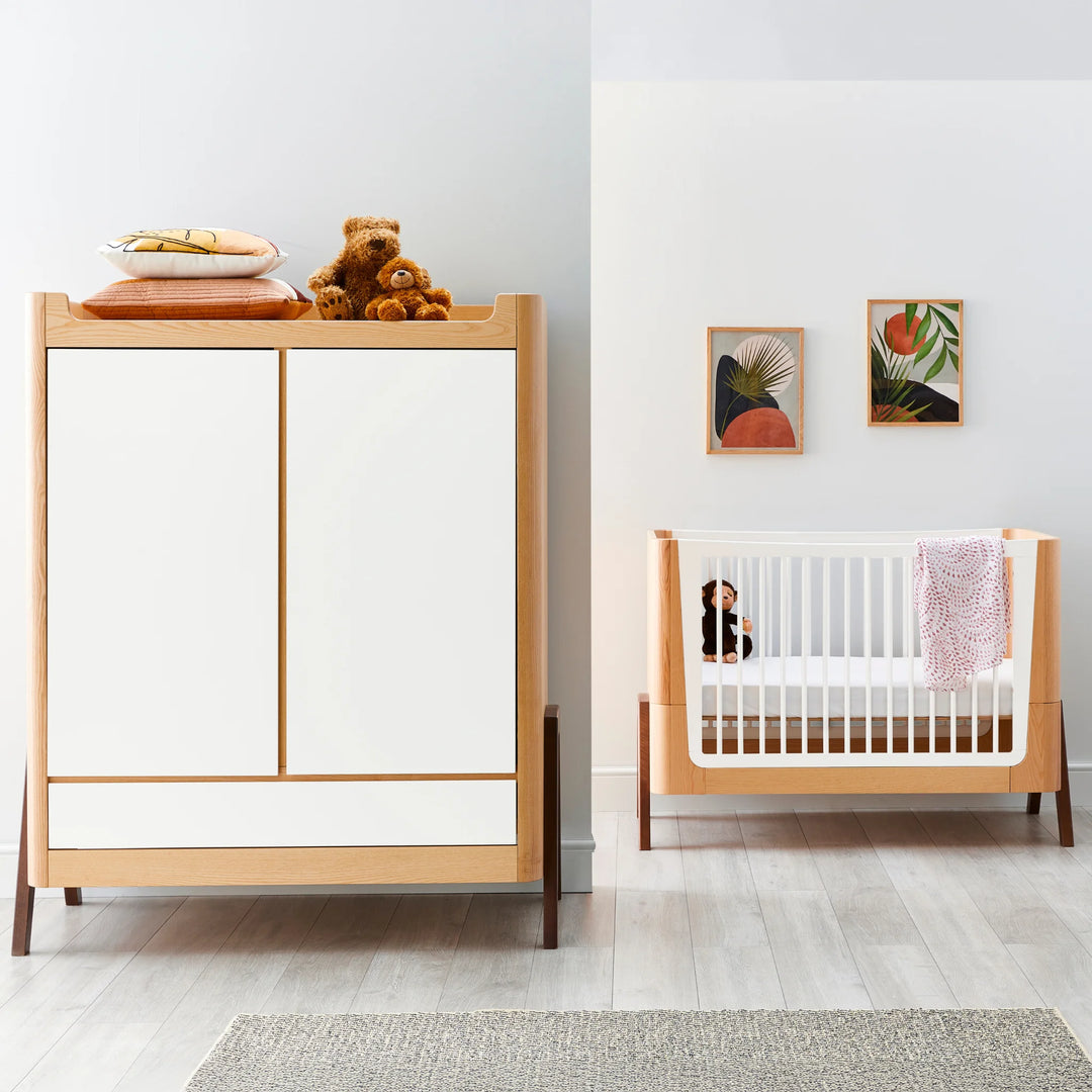 Hera Cot Bed with matching wardrobe in a minimalist nursery.