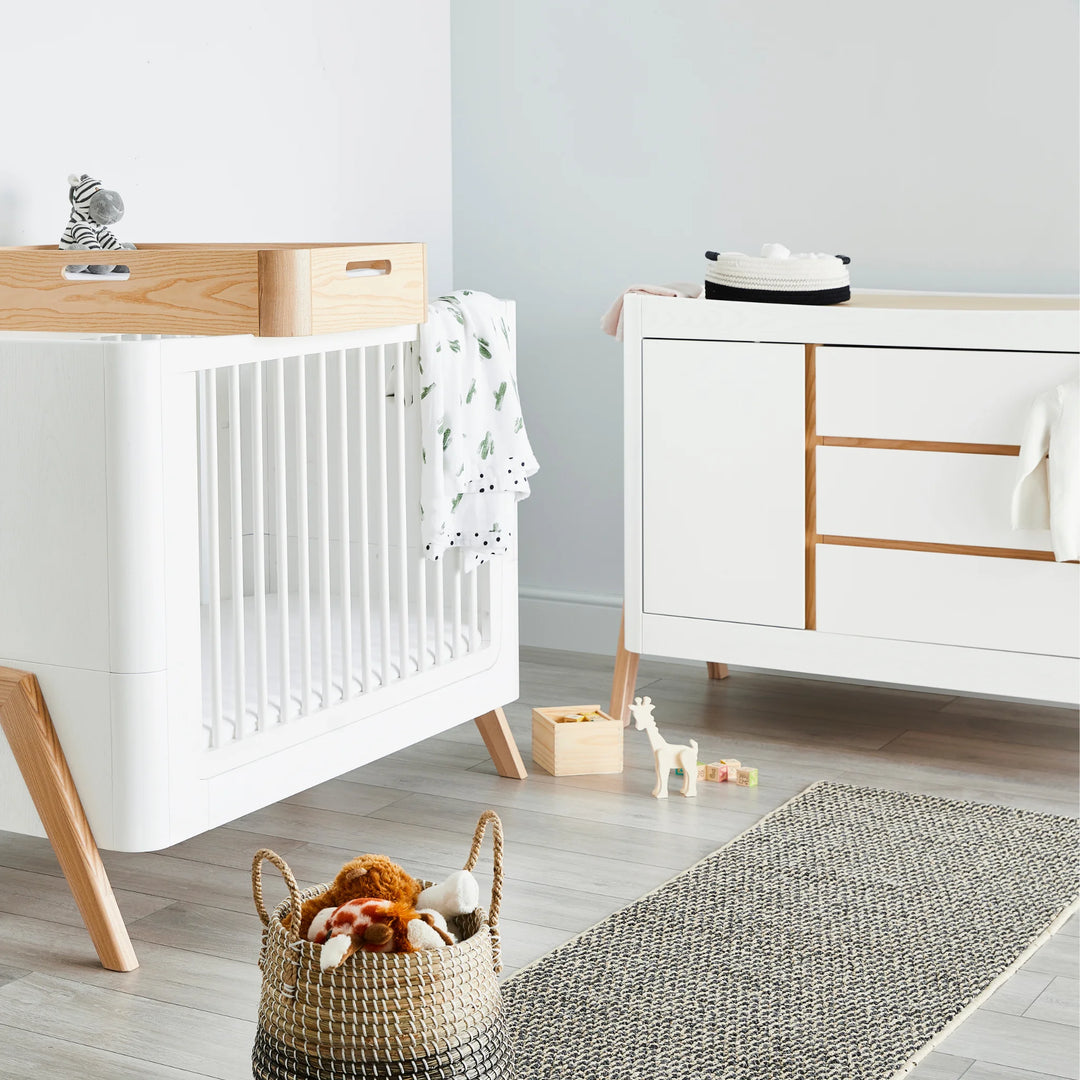 Hera Dresser with matching Cot Bed and Changing Station on cot bed.