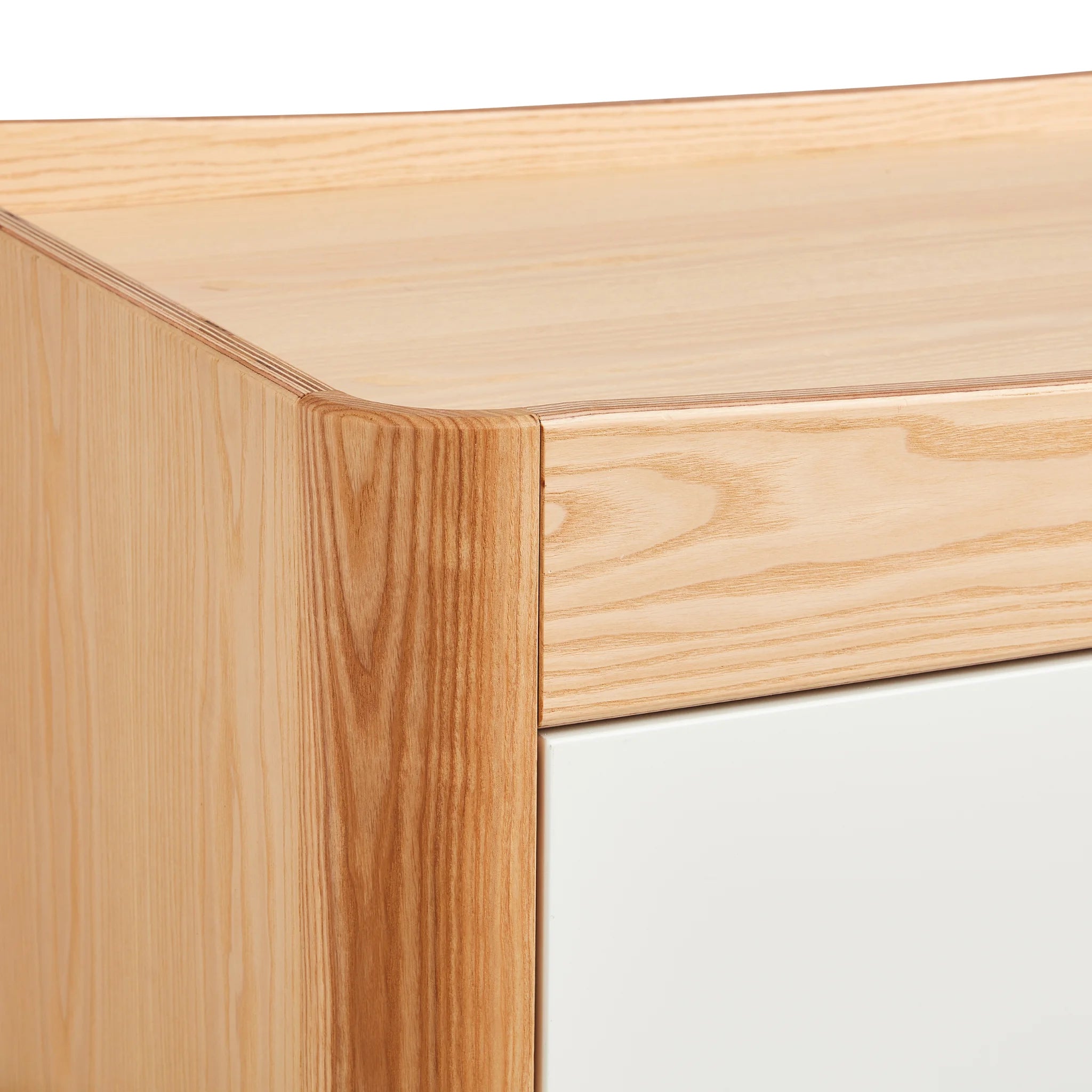 Hera Dresser real wood corner close up of smooth contoured edges.