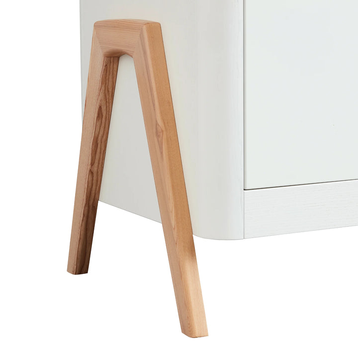 Close up of the real natural wood a-frame legs on the Gaia Baby Hera Dresser in scandi white.