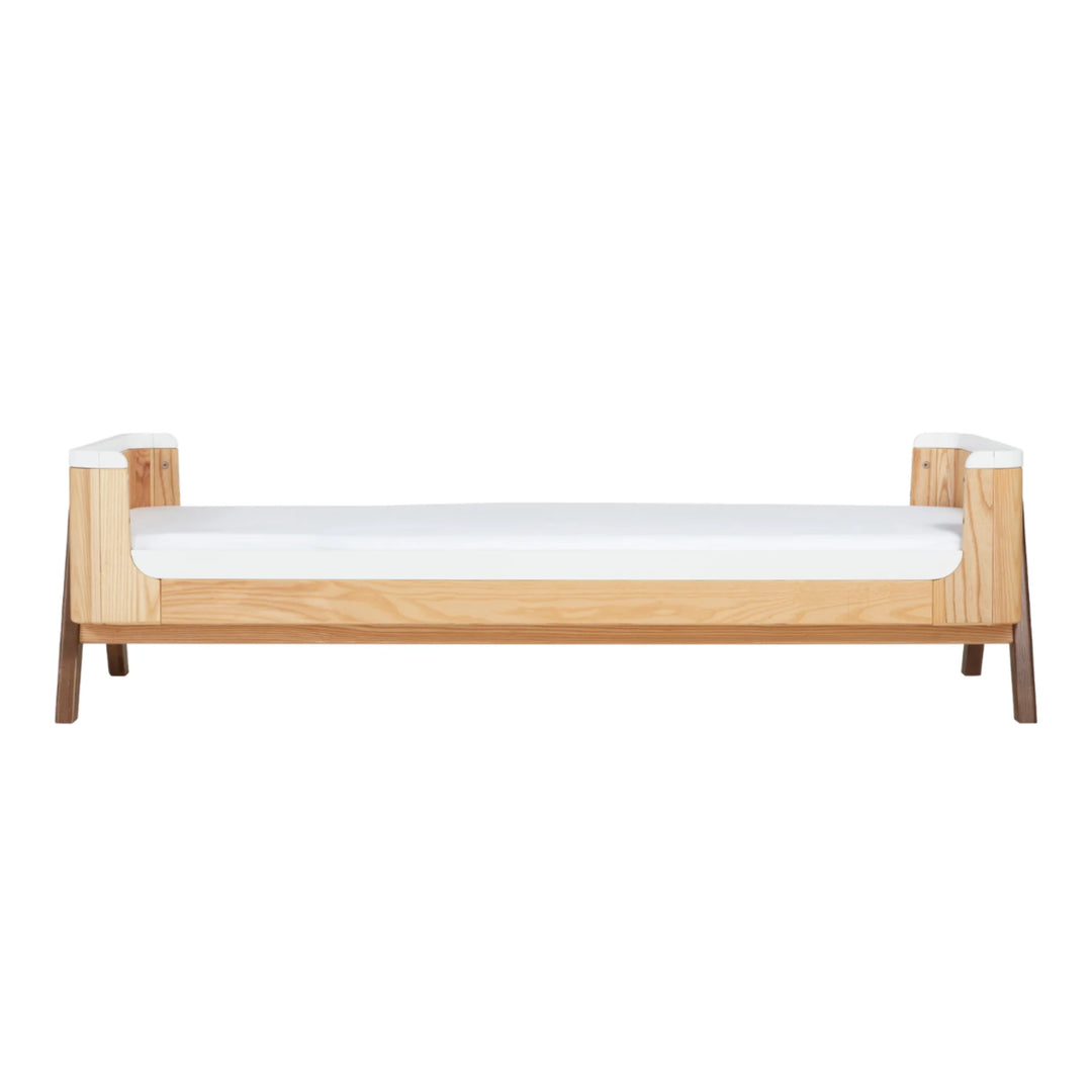 Front view of the Gaia Baby Hera Junior Bed Extension Kit in White / Natural when added to the Hera Cot Bed.