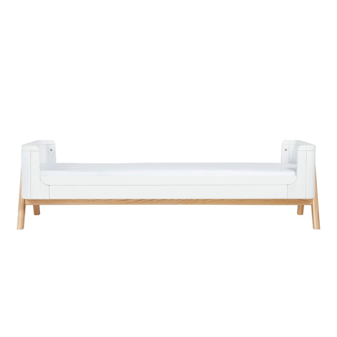 Front view of the Gaia Baby Hera Junior Bed Extension Kit in Scandi White when added to the Hera Cot Bed.