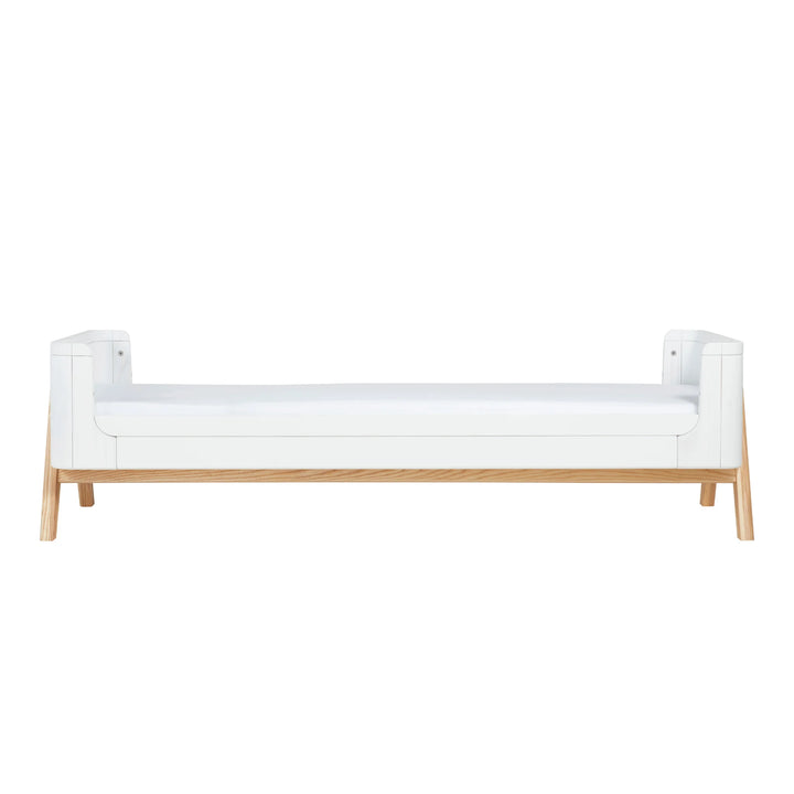 Front view of the Gaia Baby Hera Junior Bed Extension Kit in Scandi White when added to the Hera Cot Bed.