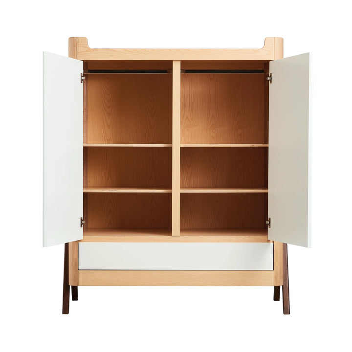 Front view of Gaia Baby Hera Nursery wardrobe in white natural wood, doors open showing hanging rail and 6 shelves. Below open doors is a full width drawer.