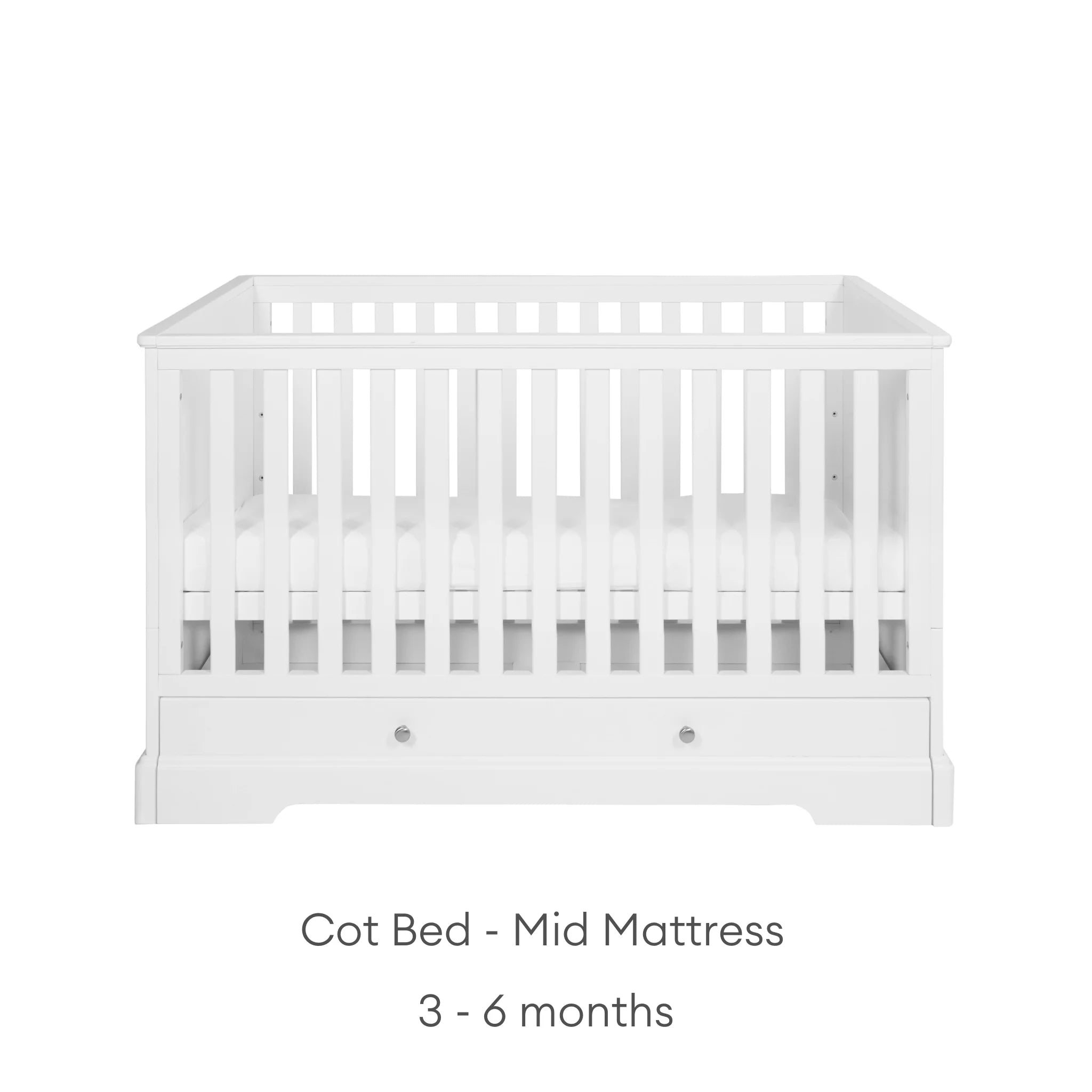 White cot with mid mattress height suitable from 3-6 months on a white background