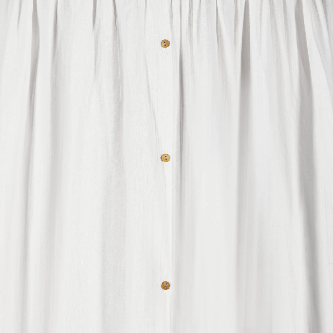 A closeup image of the buttons on Gaia Baby Maia Collection Canopy in white