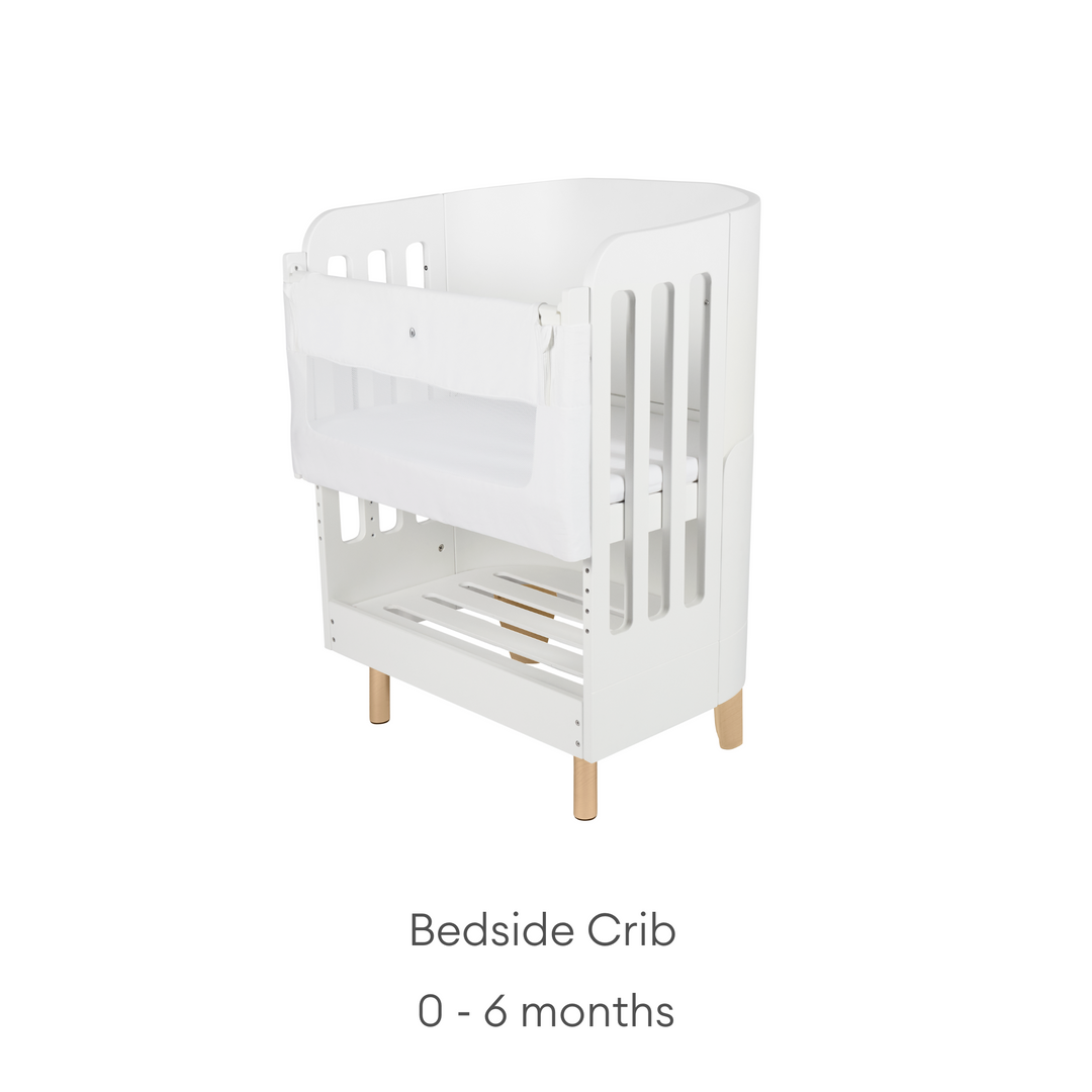 Gaia Baby Serena Bedside Crib Add On angled product shot with natural legs and age range 0-6 months below.