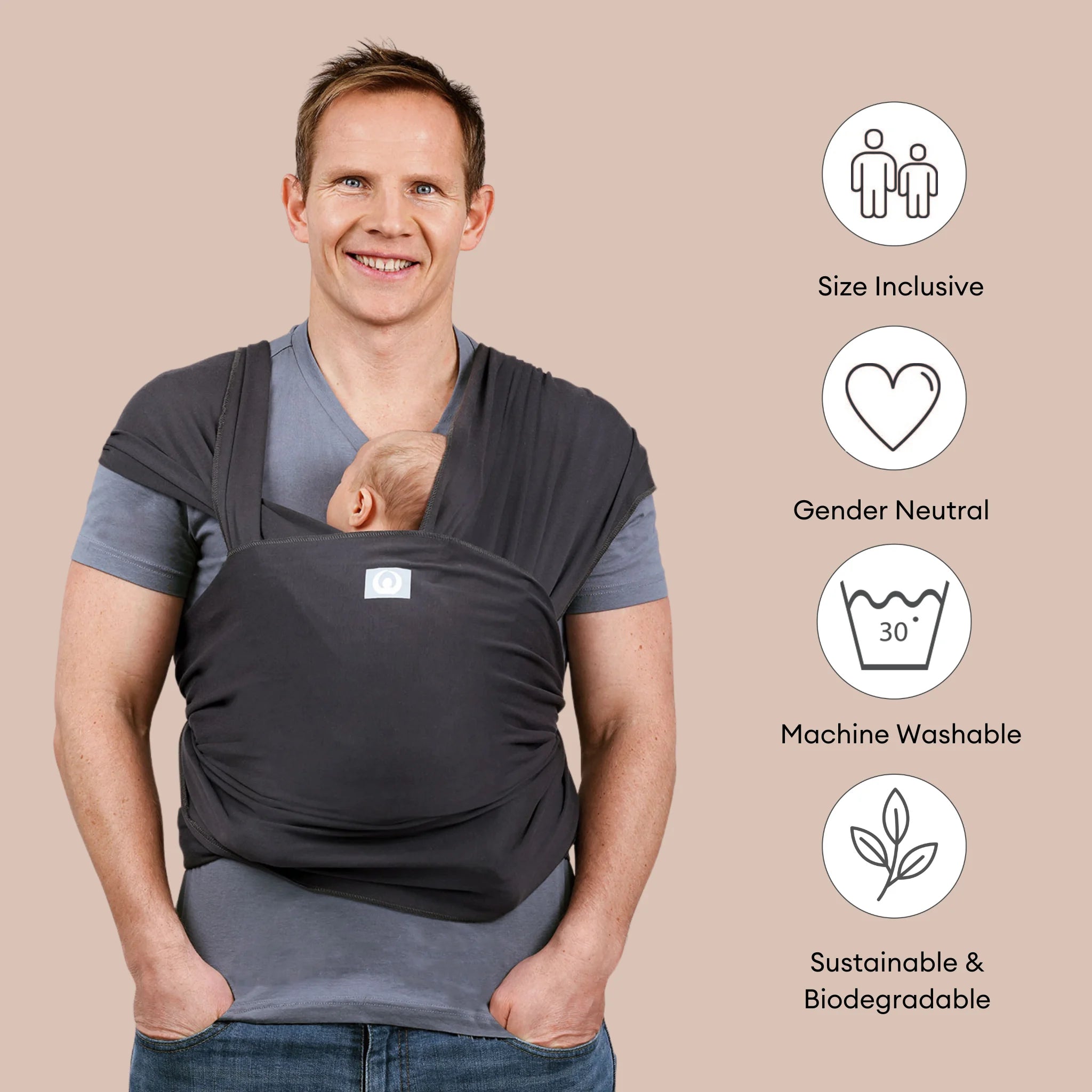 Father carrying baby in Gaia Baby Graphite organic cotton stretchy baby wrap carrier