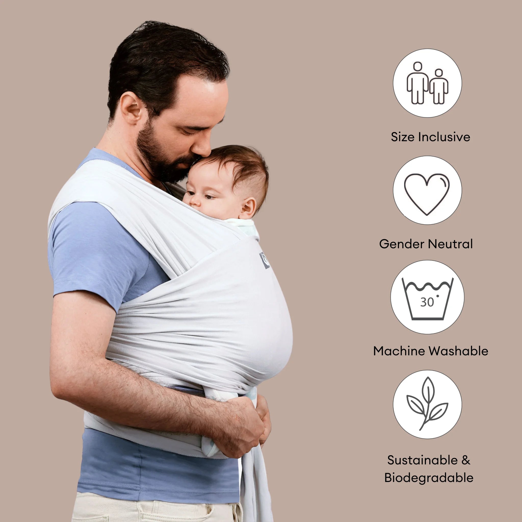 Father carrying baby in Gaia Baby stretchy wrap in silver grey highlighting size inclusive gender neutral sustainable features