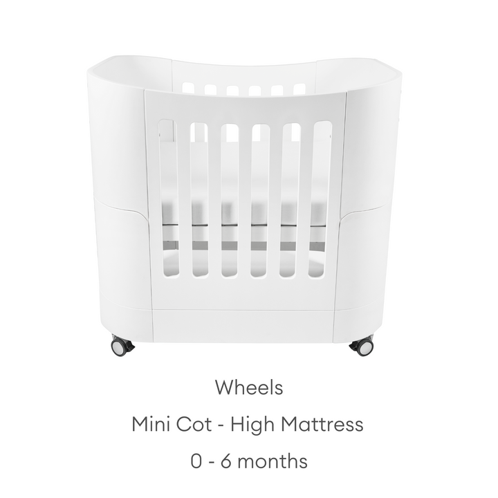 product image of Gaia baby Serena mini Cot with wheels showing the high mattress