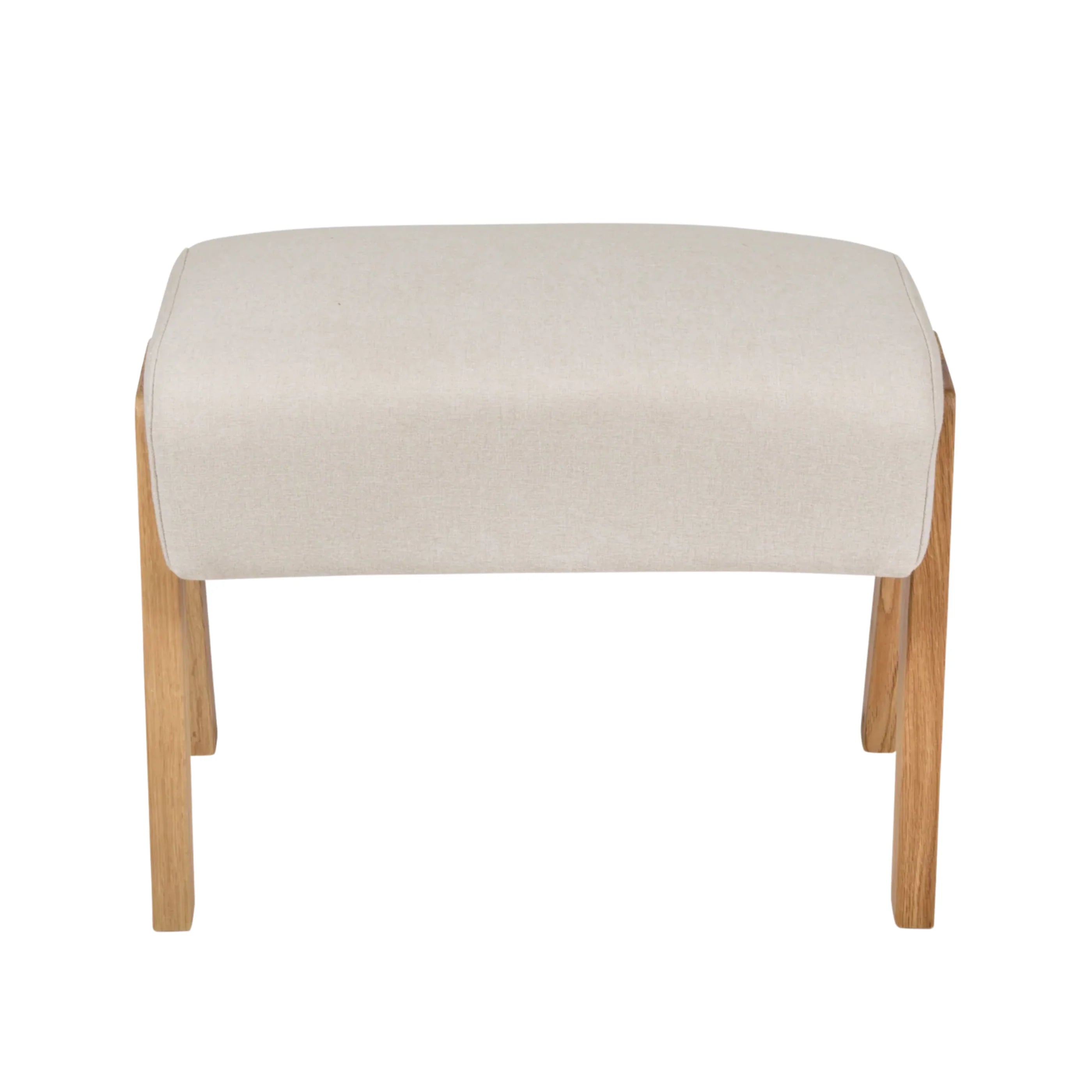 Hera Footstool Barley colour front view, upholstered nursery footrest with solid wood legs by Gaia Baby isolated on white.