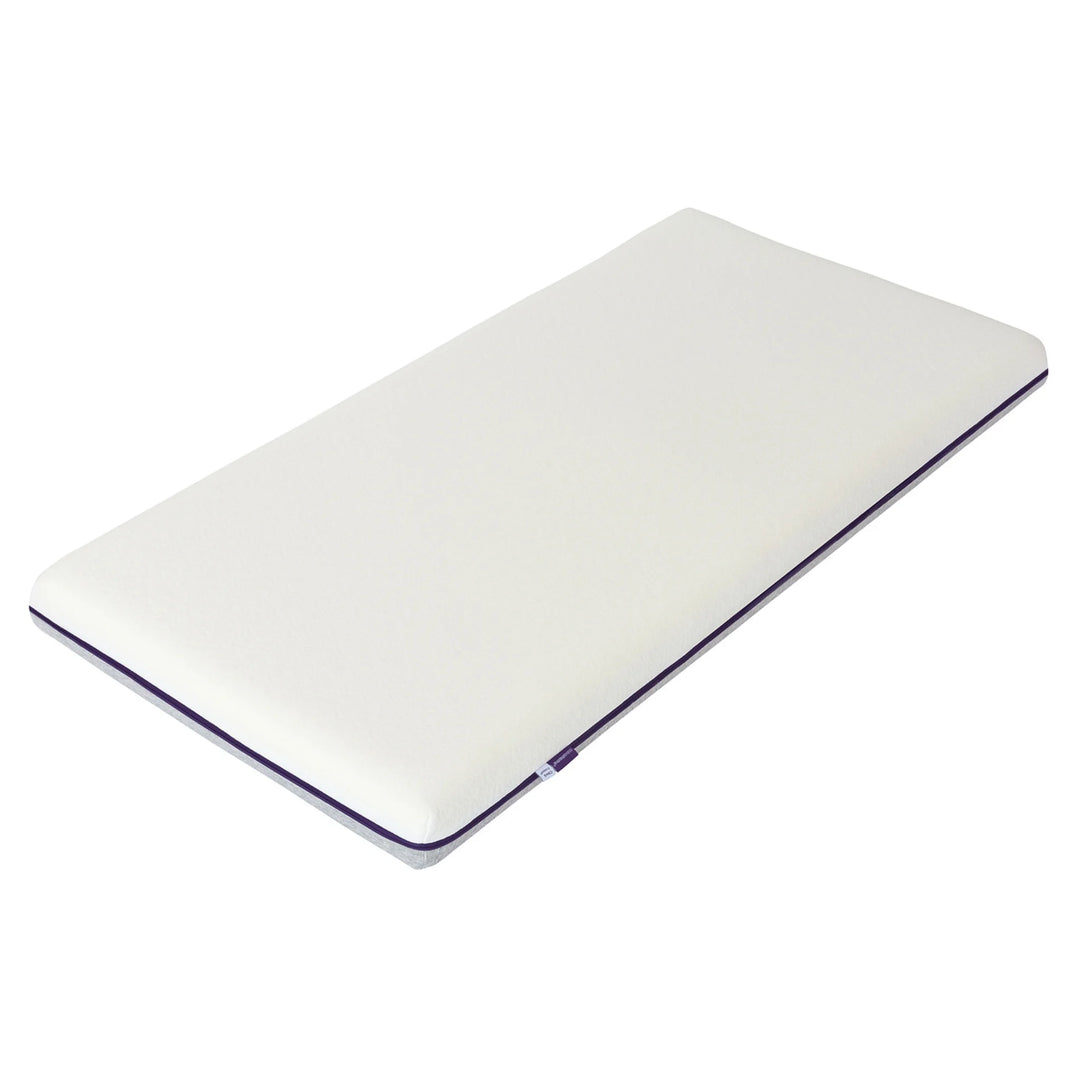 ClevaMama ClevaFoam premium support cot mattress in white with contoured design, shown on a white background