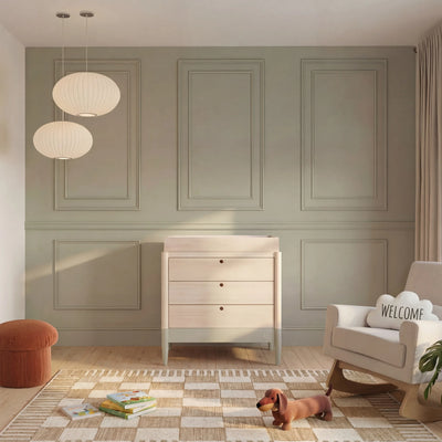 Gaia Baby EOS natural wood nursery dresser with changing top styled in modern nursery room