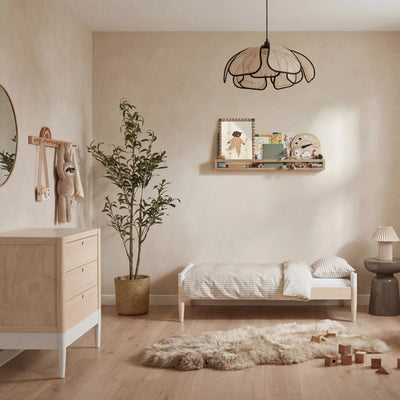 Modern nursery with Gaia Baby EOS toddler bed and dresser in natural wood and white finish