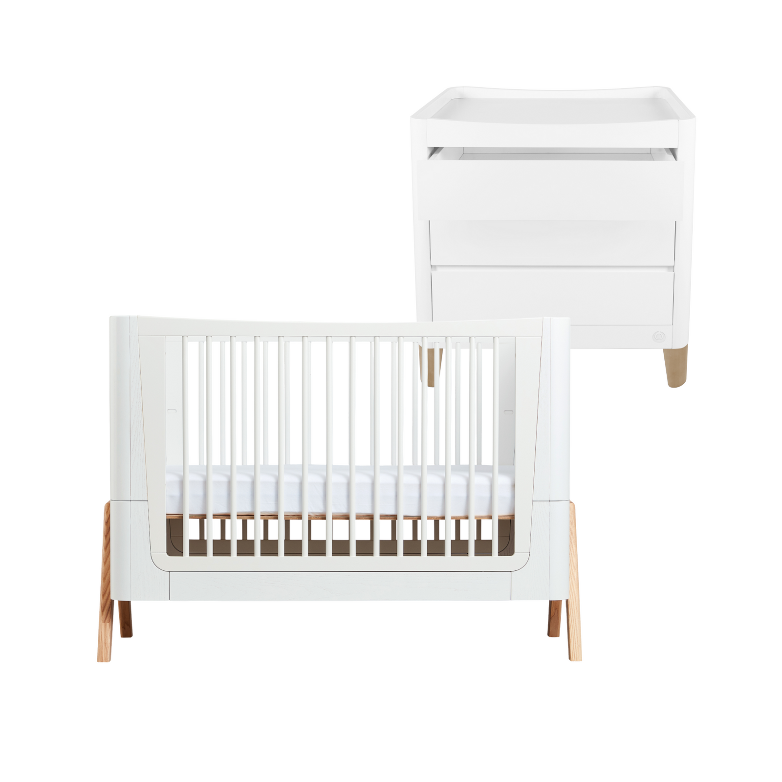 Hera Cot Bed in Scandi White Natural in front of the Serena Dresser with natural legs.