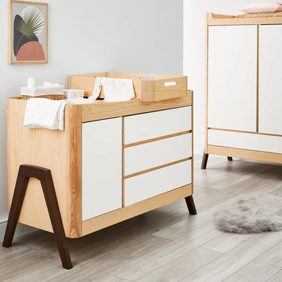 Hera Dresser with matching wardrobe and changing station styled in neutral nursery.