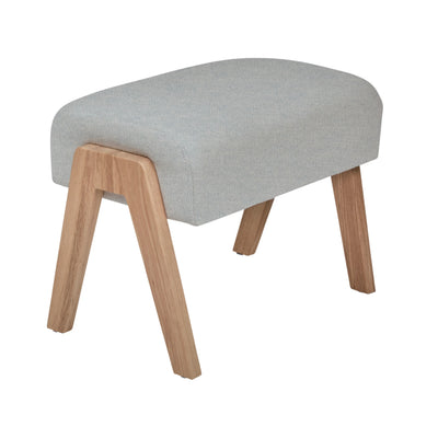 Hera Footstool Dusk colour with wooden legs, upholstered nursery footrest by Gaia Baby isolated on white.
