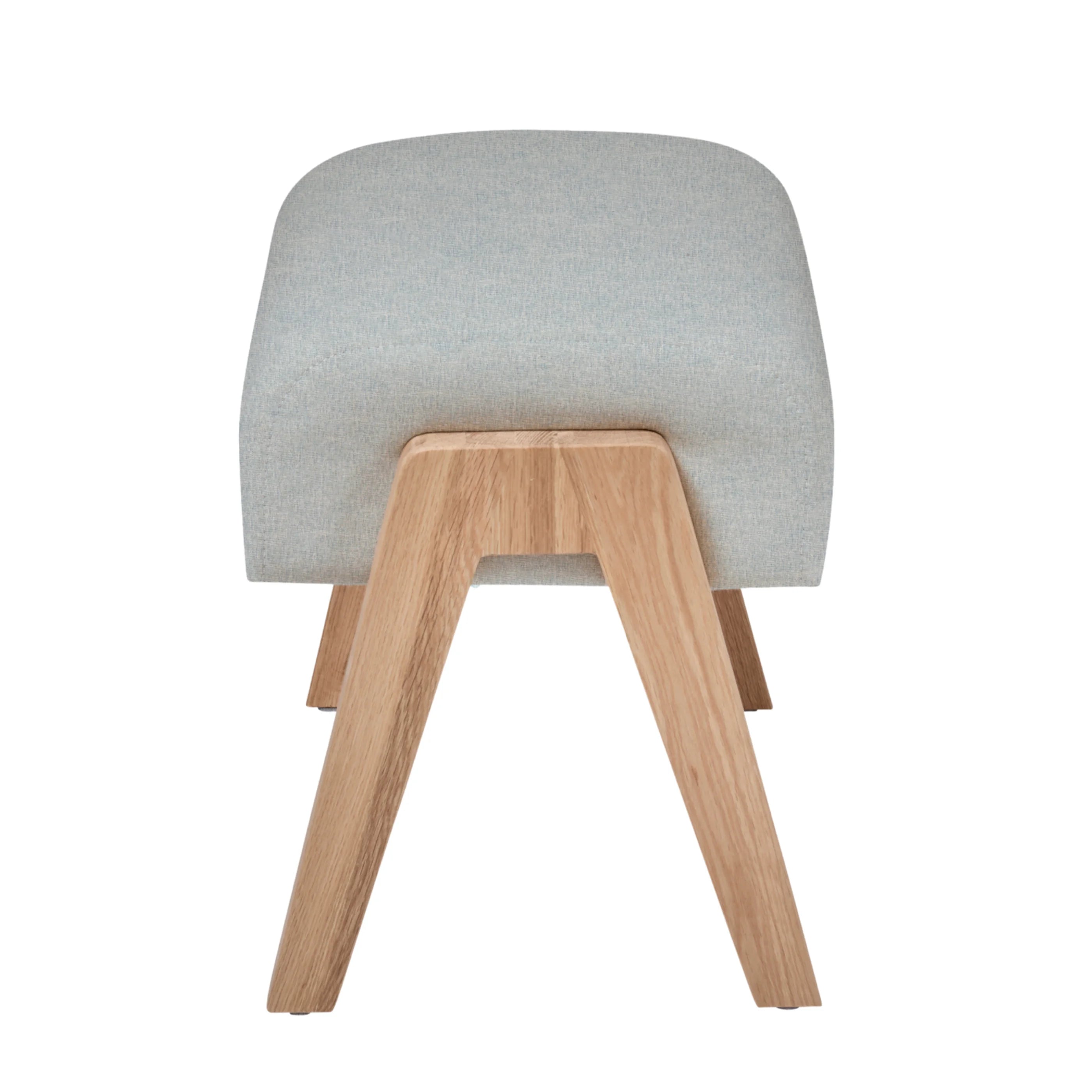 Gaia Baby Hera Footstool in Dusk fabric with natural wooden legs, rear side view of upholstered nursery footstool on white background.
