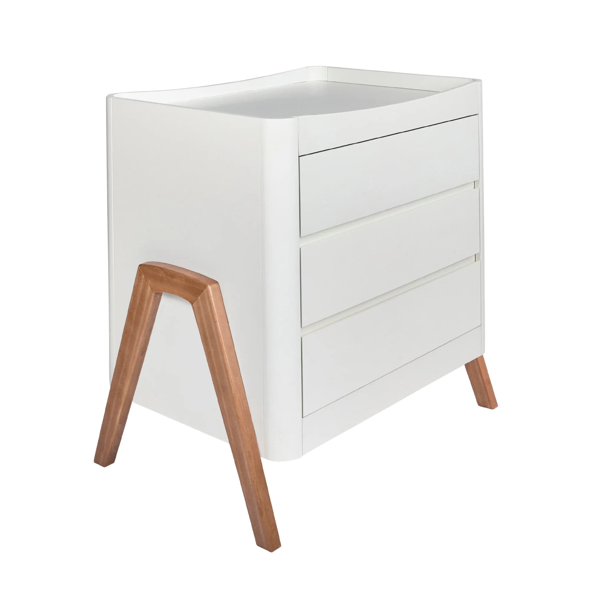 Angled view of the Gaia Baby Hera dresser in white and oak, featuring three drawers, softly rounded edges, and distinctive A-frame wooden legs, shown on a white background.