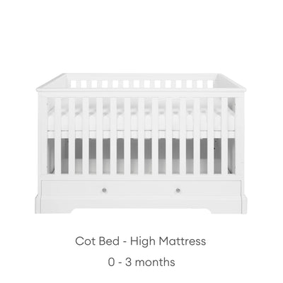 White cot with high mattress height suitable from 0-3 months on a white background