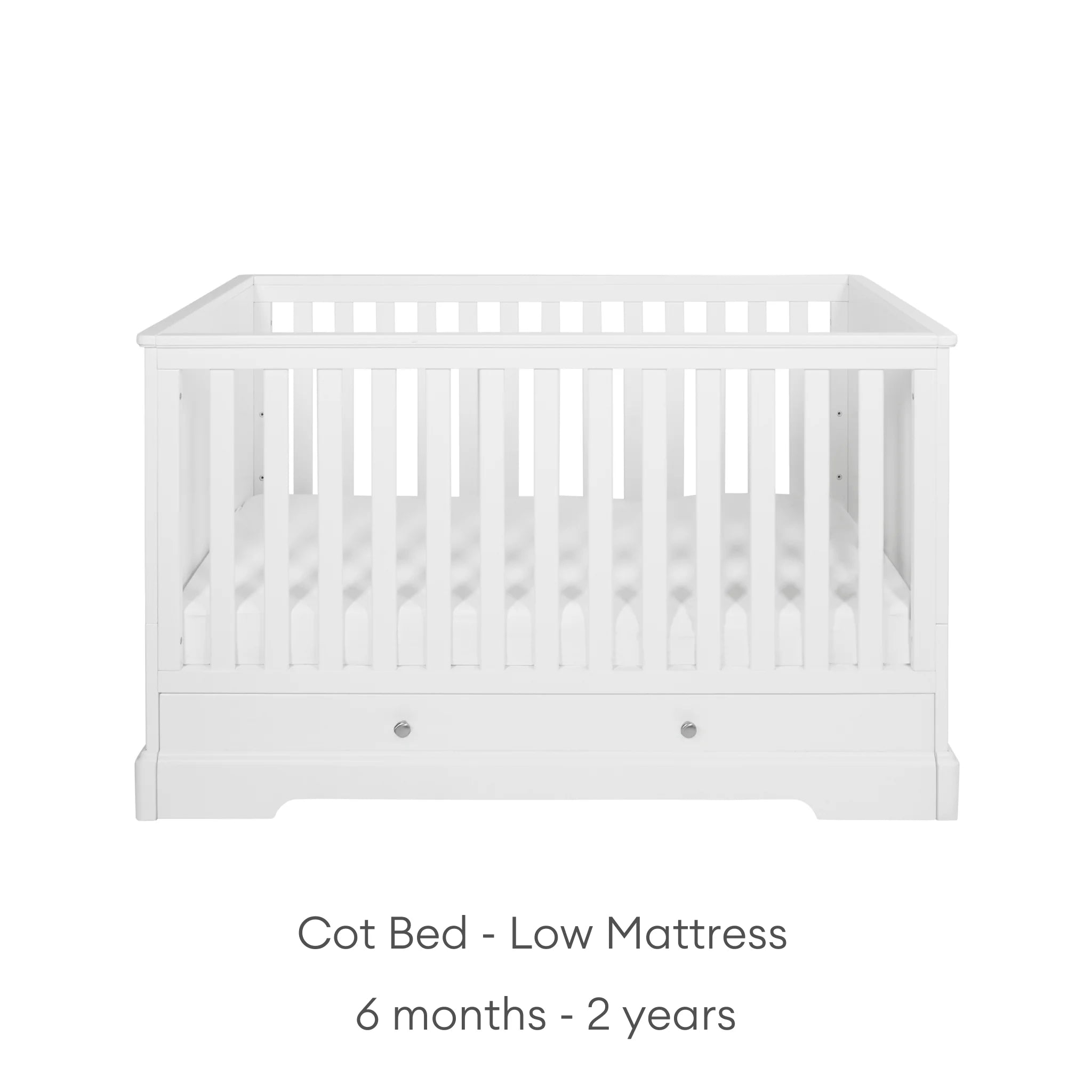 White cot with low mattress height suitable from 6 months - 2 years on a white background