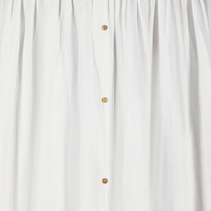 A closeup image of the buttons on Gaia Baby Maia Collection Canopy in white