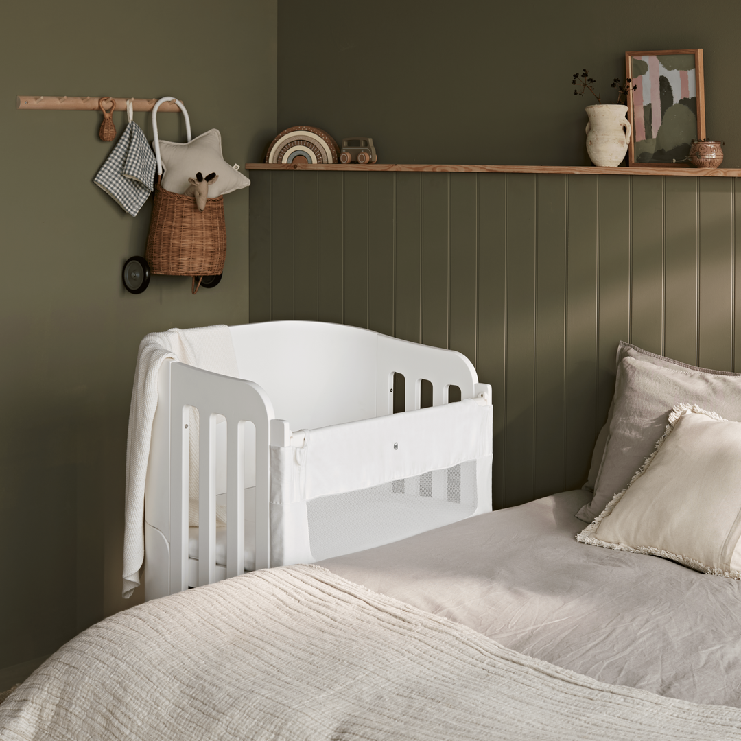 Gaia Baby Serena Bedside Crib Add On with Walnut Legs and the mesh panel is up