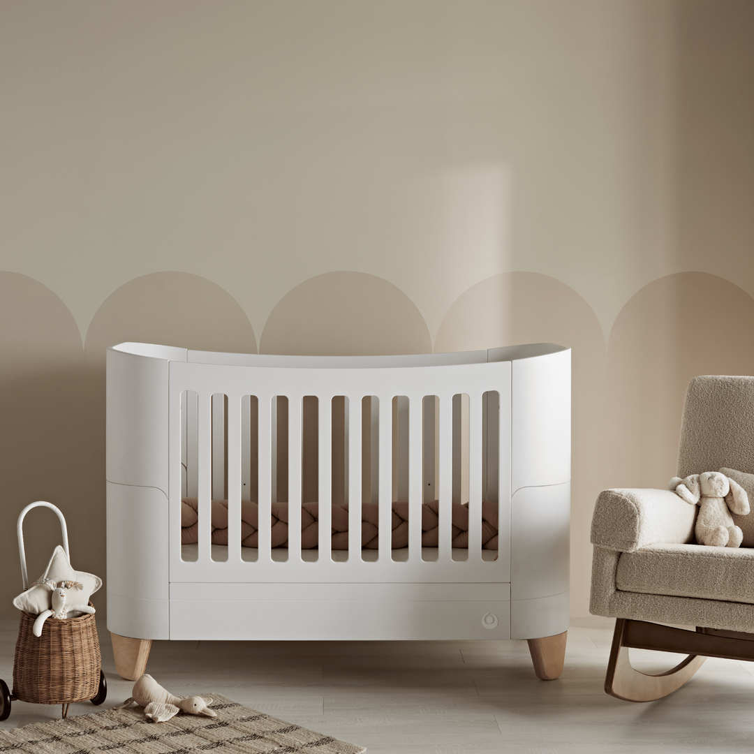 Gaia Baby Serena Cot Bedwith natural legs. Lifestyle image in a nursery