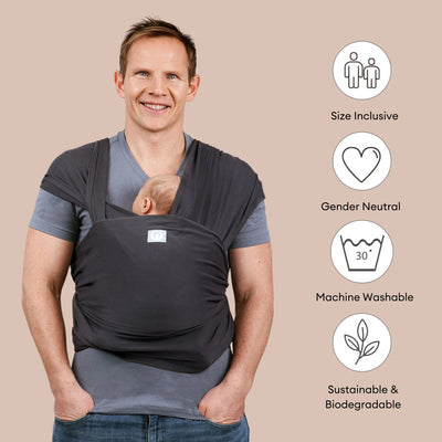 Father carrying baby in Gaia Baby Graphite organic cotton stretchy baby wrap carrier