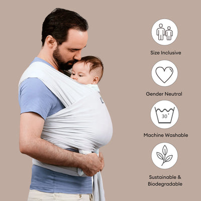 Father carrying baby in Gaia Baby stretchy wrap in silver grey highlighting size inclusive gender neutral sustainable features