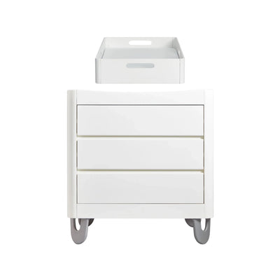 Front view of Gaia Baby Serena white dresser with matching white changing tray on top