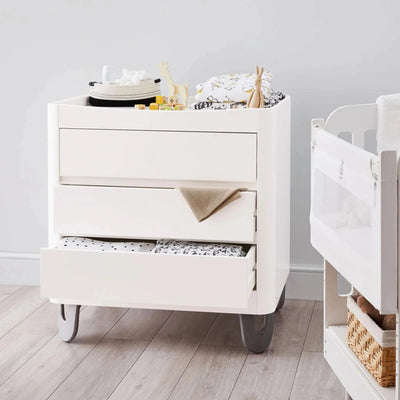 White Gaia Baby Serena dresser with drawers open showing storage and changing tray on top