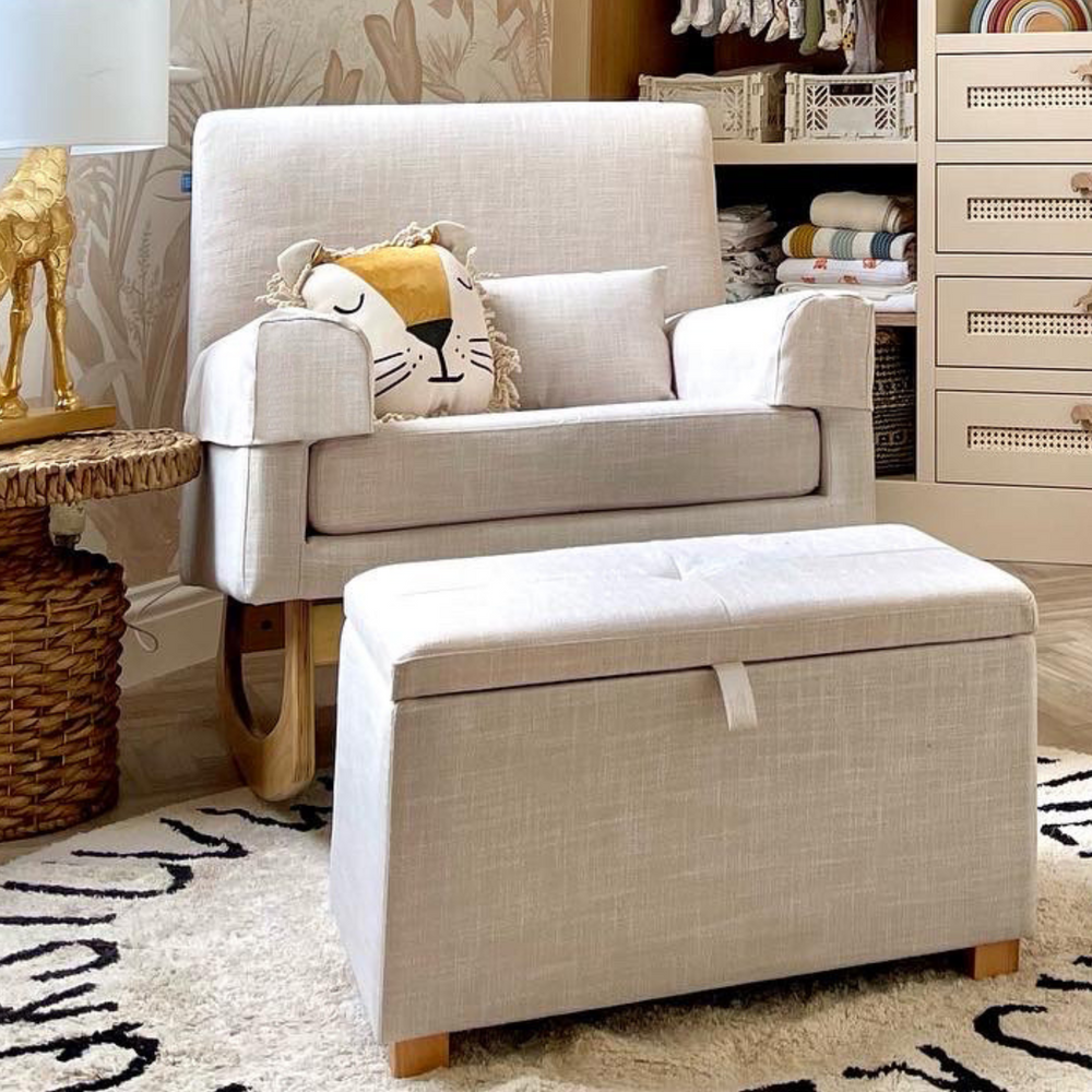 Lifestyle image of a beige Gaia Baby Nursing Chair in colour Oat and a footstool with hidden storage.