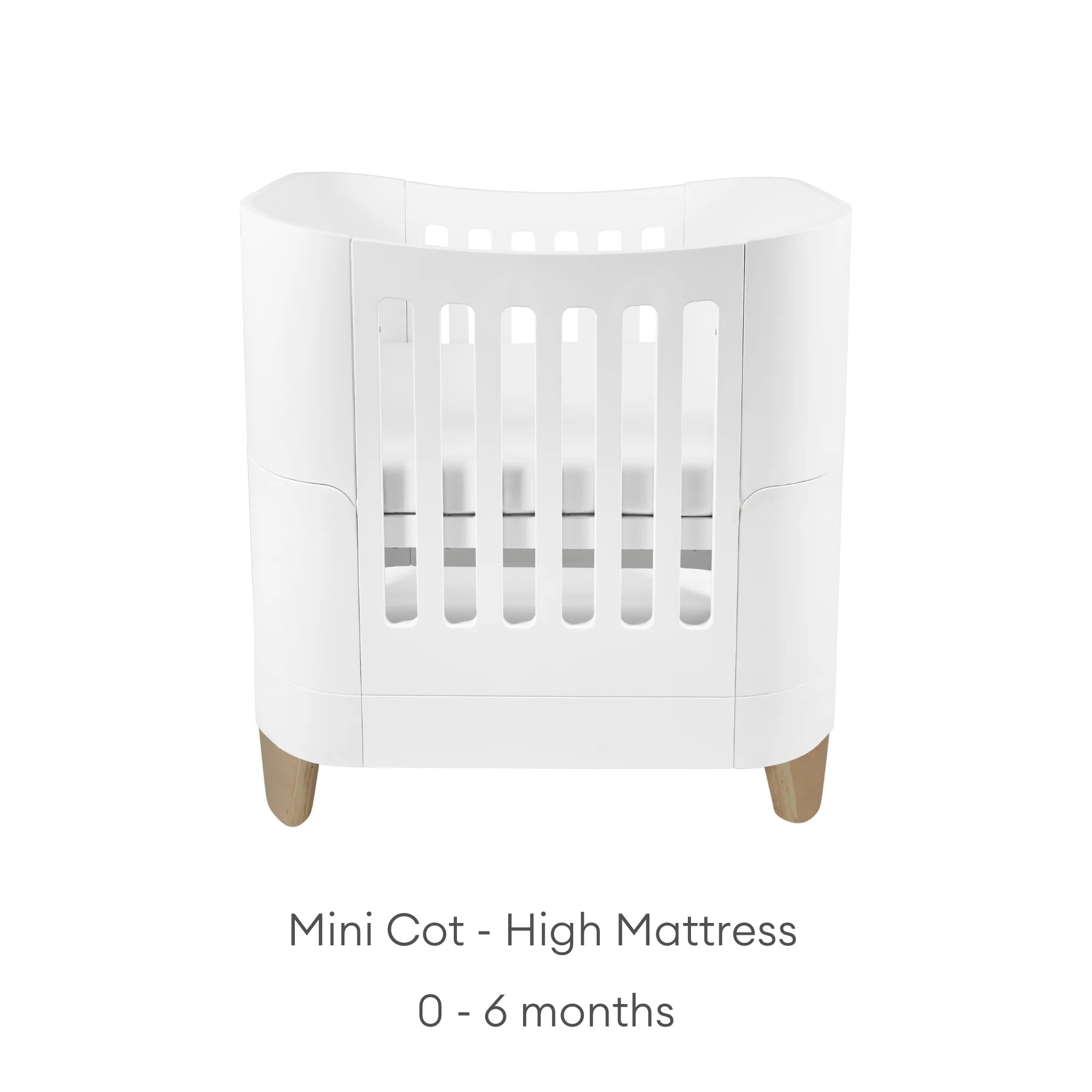 Gaia Baby Serena Mini Cot with natural wooden legs and high mattress position, white baby crib suitable for newborns 0–6 months.