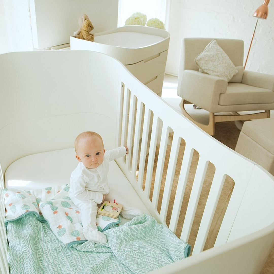 Gaia Baby Serena Sustainable Real Wood Nursery Furniture made from toxin free baby safe materials including a cot bed and dresser or changing station in all white